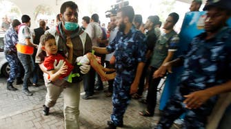 Thousands flee Gaza, bodies lay on streets
