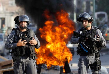 Israeli police officers stand guard during a protest by Israeli Arabs in the northern city of Nazareth. (Reuters)
