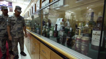 Students under training in the Drug and Poison Division of King Fahad Security College look at a collection of bottles of alcohol that Saudi security forces confiscated in the past, in Riyadh May 19, 2009. (Reuters)