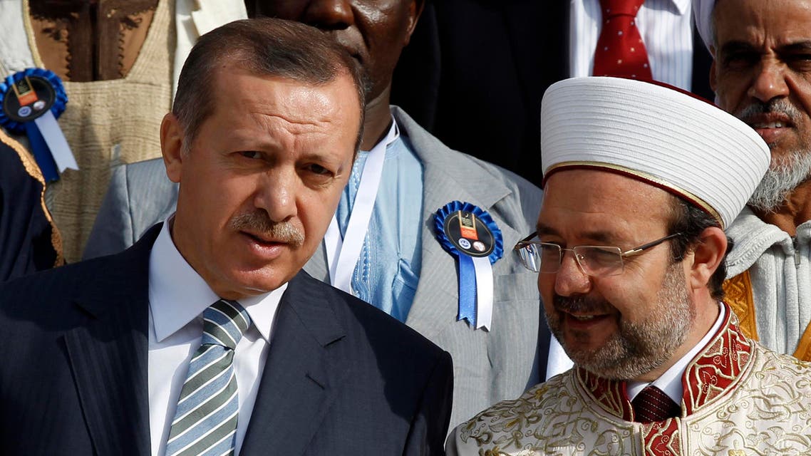 Turkey's Prime Minister Tayyip Erdogan chats with Head of Turkey's Religious Affairs Directorate Mehmet Gormez. (Reuters)