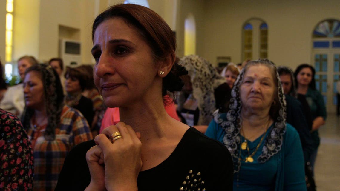 Iraqi Christians attend a mass at Mar Girgis Church in Baghdad July 20, 2014.