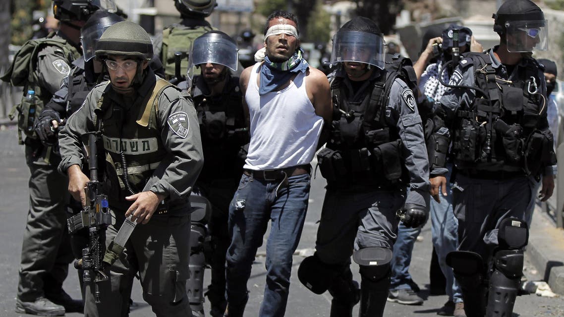 Israeli security forces arrest a Palestinian (C) during clashes following traditional Friday prayers near the Old City in East Jerusalem on July 25, 2014. (Reuters)