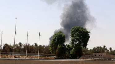 Smoke rises over the Airport Road area after heavy fighting between rival militias broke out near the airport in Tripoli July 25, 2014. (Reuters)