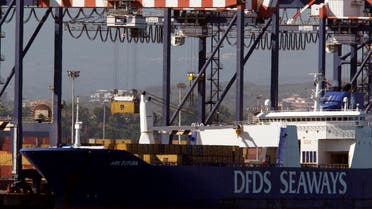 A container (top L) is moved from the Danish ship Ark Future, carrying a cargo of Syria's chemical weapons, after it arrived at Gioia Tauro port in southern Italy July 2, 2014.