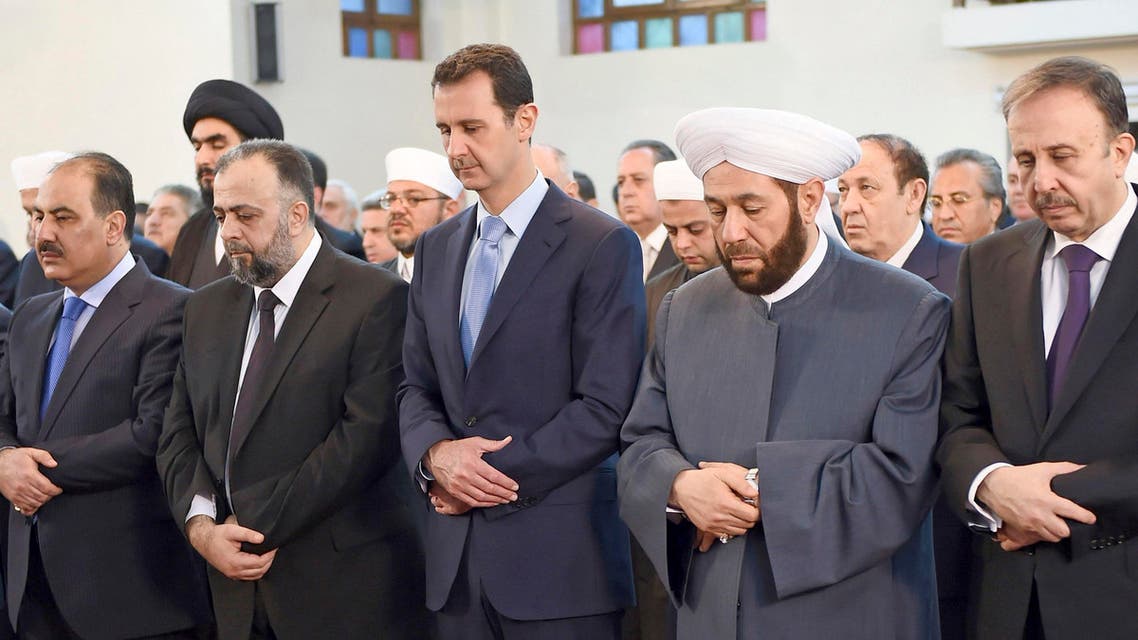 Syria's President Bashar al-Assad (C) attends Eid al-Fitr prayers at al-Khair mosque in Damascus July 28, 2014, in this handout photograph released by Syria's national news agency SANA. Reuters