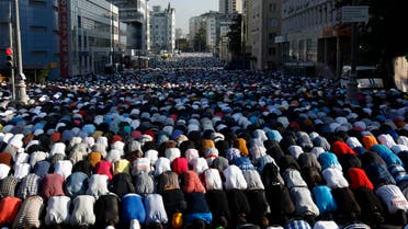 Thousands of believers take part in morning prayers to celebrate the first day of Eid-al-Fitr in Moscow August 8, 2013