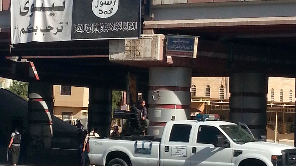 A fighter from the Islamic State, formerly known as the Islamic State of Iraq and the Levant (ISIL), mans an anti-aircraft gun mounted on the rear of a vehicle in Mosul July 16, 2014.