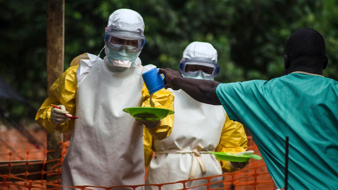 Medical staff working with Medecins sans Frontieres (MSF) prepare to bring food to patients kept in an isolation area at the MSF Ebola treatment centre in Kailahun July 20, 2014