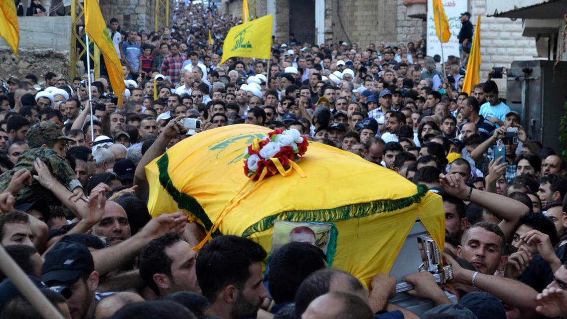 Mourners carry the coffin of Ibrahim al-Haj, a Hezbollah commander who died during a mission in Iraq, during his funeral in Mashghara village in the Bekaa Valley July 30, 2014