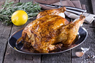 A whole roasted chicken is displayed. (Stock image)