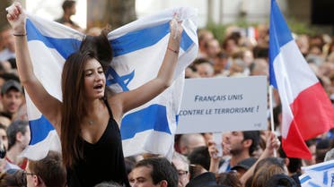 People demonstrate to support Israel's military action in the Gaza strip, near Israel's embassy in Paris, July 31, 2014.