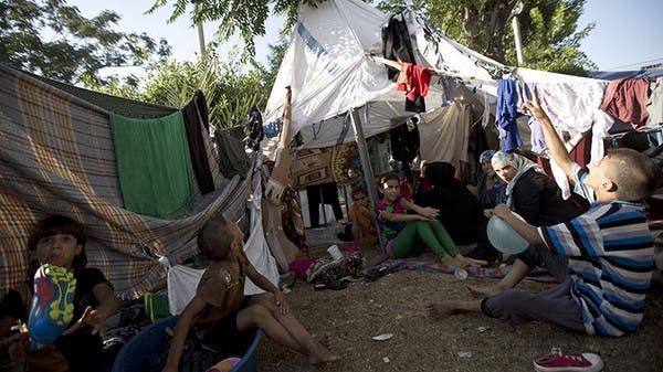 فلسطينيون دمرت بيوتهم في القصف الاسرائيلي على غزة