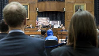 Syria defector in Washington shows torture photos 