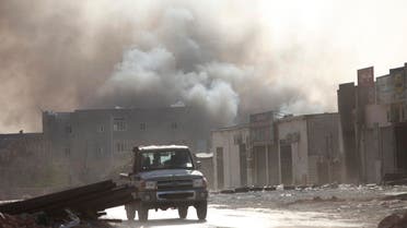Smoke rises after rockets fired by one of Libya's militias struck and ignited a building after clashes between rival militias, in an area at Alswani road in Tripoli August 2, 2014. Reuters 