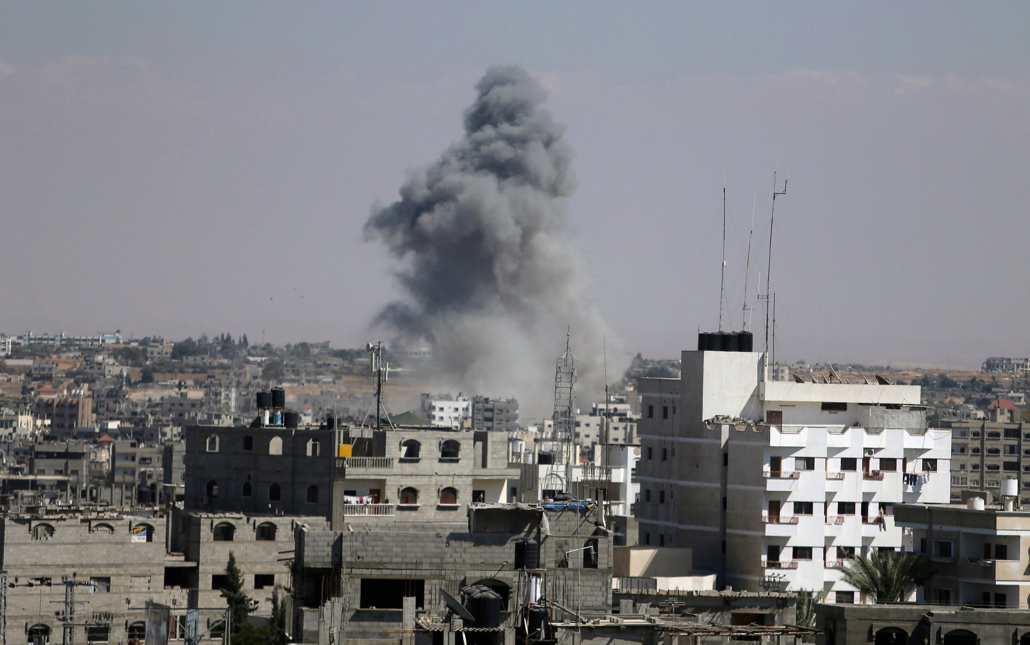 Smoke rises following what witnesses said was an Israeli air strike in Rafah in the southern Gaza Strip August 3, 2014. An Israeli air strike killed at least 10 people