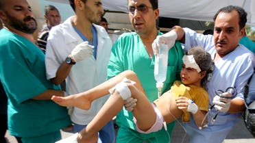 Palestinian medics carry a girl, whom they said was wounded by an Israeli air strike, at a hospital in Rafah in the southern Gaza Strip August 2, 2014. I Reuters