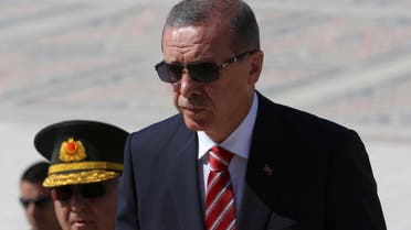  Turkish Prime Minister Recep Tayyip Erdogan (C) follows a guard of honour at the mausoleum of Turkey's founder Mustafa Kemal Ataturk prior to a meeting of the High Military Council in Ankara, on August 4, 2014.  AFP 