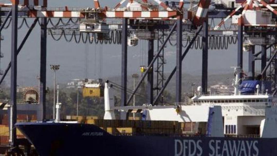 A container (top L) is moved from the Danish ship Ark Future, carrying a cargo of Syria's chemical weapons, after it arrived at Gioia Tauro port in southern Italy July 2, 2014. (Reuters)