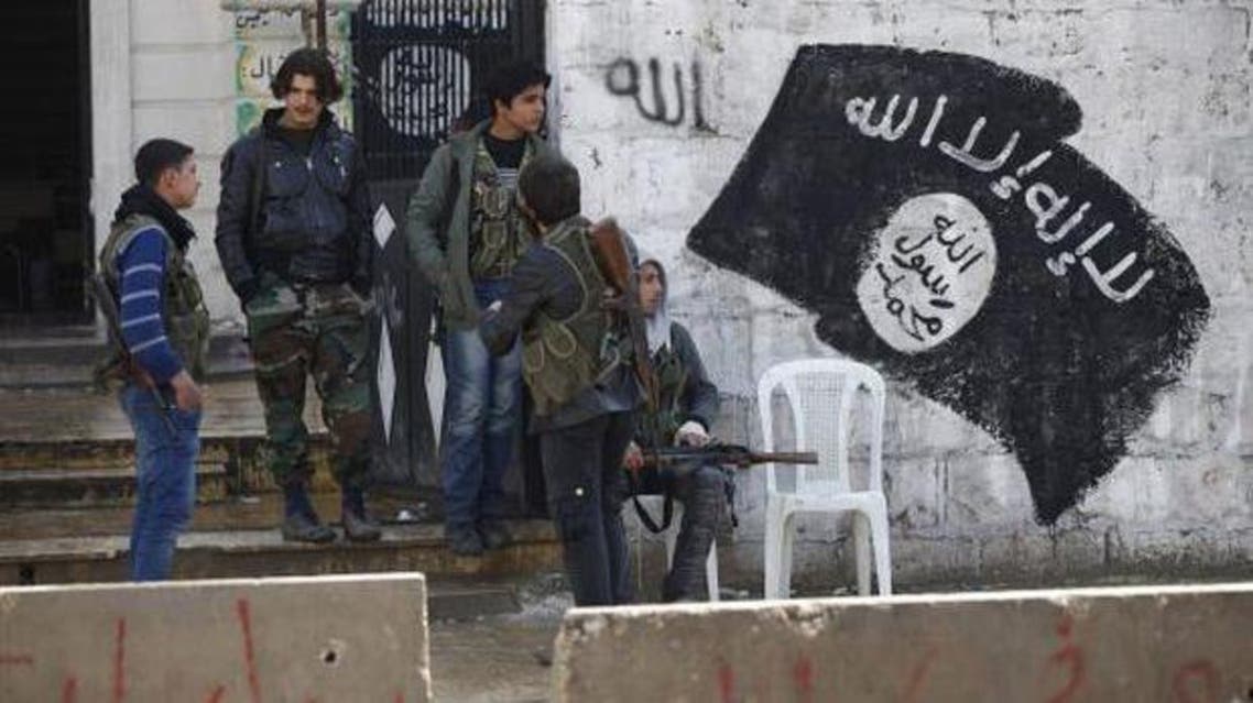 Free Syrian Army fighters stand at a former base used by fighters from the Islamic State in Iraq and Syria (ISIS), after ISIS withdrew from the town of Azaz, near the Syrian–Turkish border, on March 11, 2014. (Reuters)