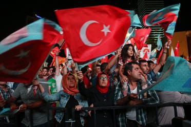 Supporters of Turkey's Prime Minister Recep Tayyip Erdogan celebrate his victory in the presidential election vote in front of the AKP party headquarters in Ankara on August 10, 2014. (AFP)