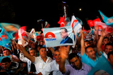 Supporters of Turkey's Prime Minister Tayyip Erdogan celebrate his election victory in front of the party headquarters in Ankara August 10, 2014.