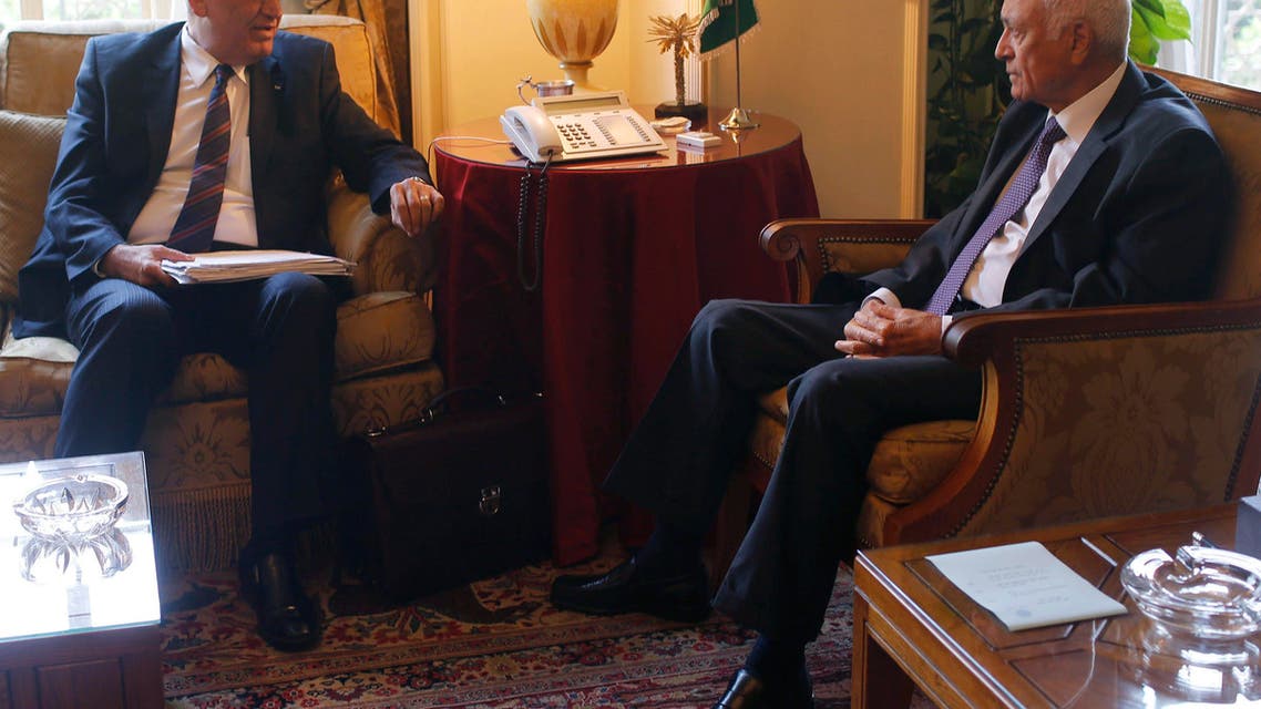 Palestinian chief negotiator Saeb Erekat (L) talks with Arab League Chief Nabil el-Araby during their meeting at the Arab League in Cairo August 11, 2014 reuters