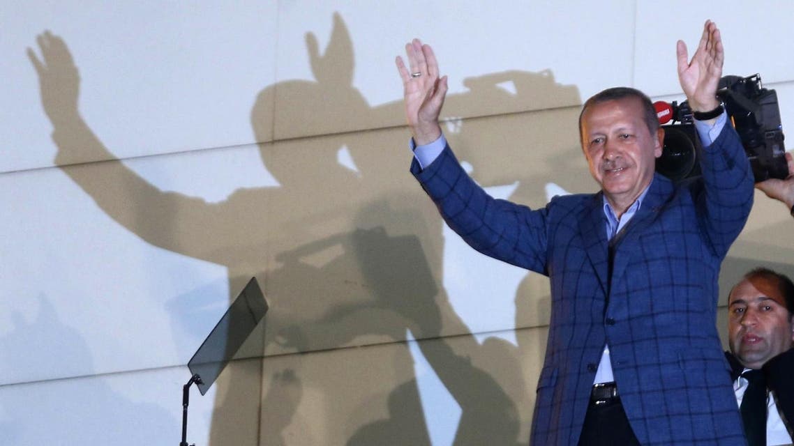 Newly elected Turkish president Recep Tayyip Erdogan waves at supporters from the balcony of the AKP party headquarters during the celebrations of his victory in the presidential election vote in Ankara on August 10, 2014. AFP