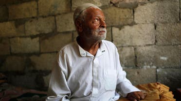 Ibrahim Mohammad al-Toum, 85, poses in his home that he says has been bombed three times in six years by the Israeli army, in Gaza City, August 11, 2014.  (Reuters)