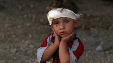 An Iraqi Yazidi child, whose family fled their home a week ago when ISIS militants attacked the town of Sinjar. (AFP)