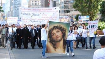Iraqi Christians protest ISIS atrocities in flag-free, silent Toronto march