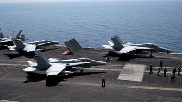 An F/A-18F Super Hornet of Strike Fighter Squadron (VFA-213) (R) and an F/A-18C Hornet of Strike Fighter Squadron (VFA-15) prepare for take off onboard the aircraft carrier USS George H.W. Bush in the Gulf August 13, 2014. (Reuters) 