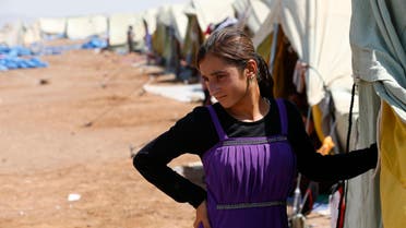 A displaced girl from the minority Yazidi sect, who fled the violence in the Iraqi town of Sinjar, stands at Nowruz refugee camp in Qamishli, northeastern Syria on the border with Kurdistan August 16, 2014. (Reuters)