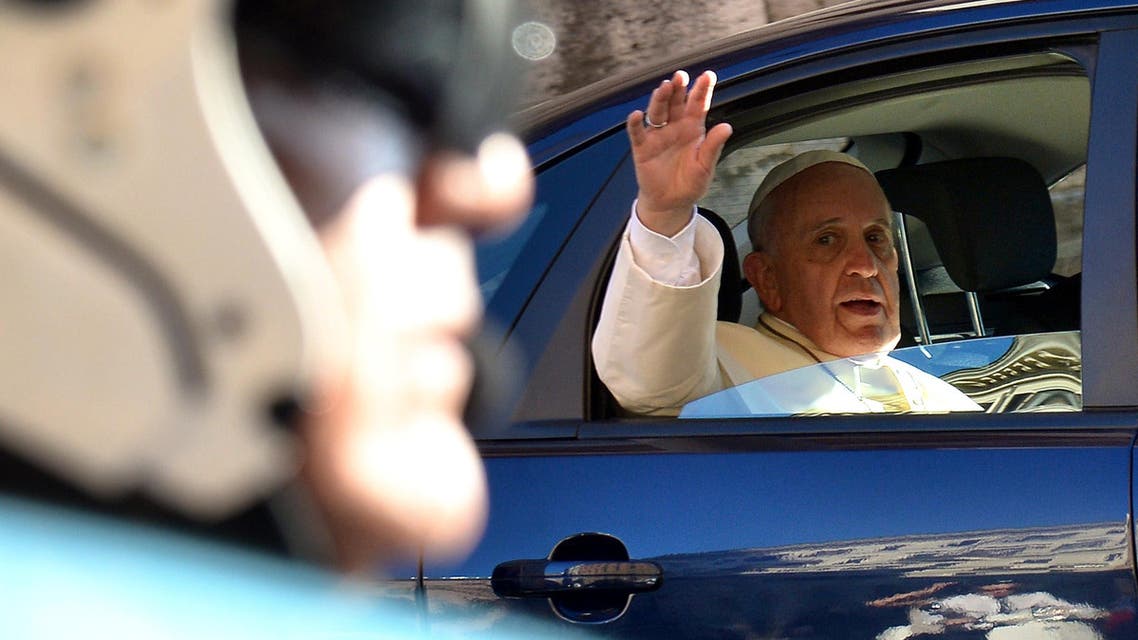 Pope Francis waves from his car as he leaves after the visit to St. Mary Major Basilica in Rome on August 18, 2014. (AFP) 