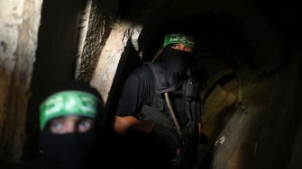 Hamas fighters show defiance in Gaza tunnel tour