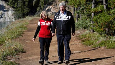Canada's Prime Minister Stephen Harper (R) and his wife Laureen tour Miles Canyon near Whitehorse, Yukon August 21, 2014.