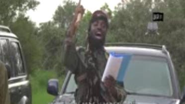 A screengrab taken on August 24, 2014 from a video released by Boko Haram and obtained by AFP shows the group's leader, Abubakar Shekau (C), delivering a speech at an undisclosed location. (AFP)