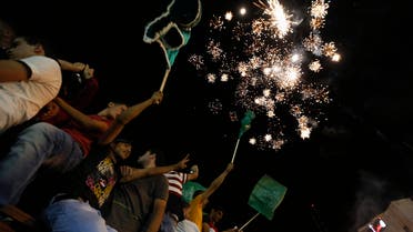 Palestinians release fireworks as they celebrate what they said was a victory by Palestinians in Gaza over Israel following a ceasefire, in the West Bank city of Ramallah August 26, 2014. reuters
