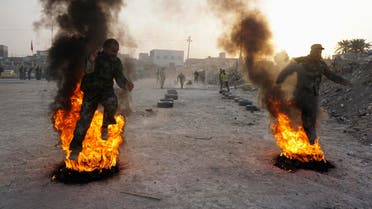 Shi'ite volunteers, who have joined the Iraqi army to fight against ISIS militants take part in field training in Najaf, August 20, 2014. (Reuters)