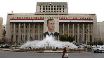 Syria's Assad forms government, 11 new ministers