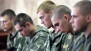 Russian paratroopers captured by Ukrainian forces near the village of Dzerkalne, Donetsk region, some 20 to 30 kilometres from the Russian border. (AFP)