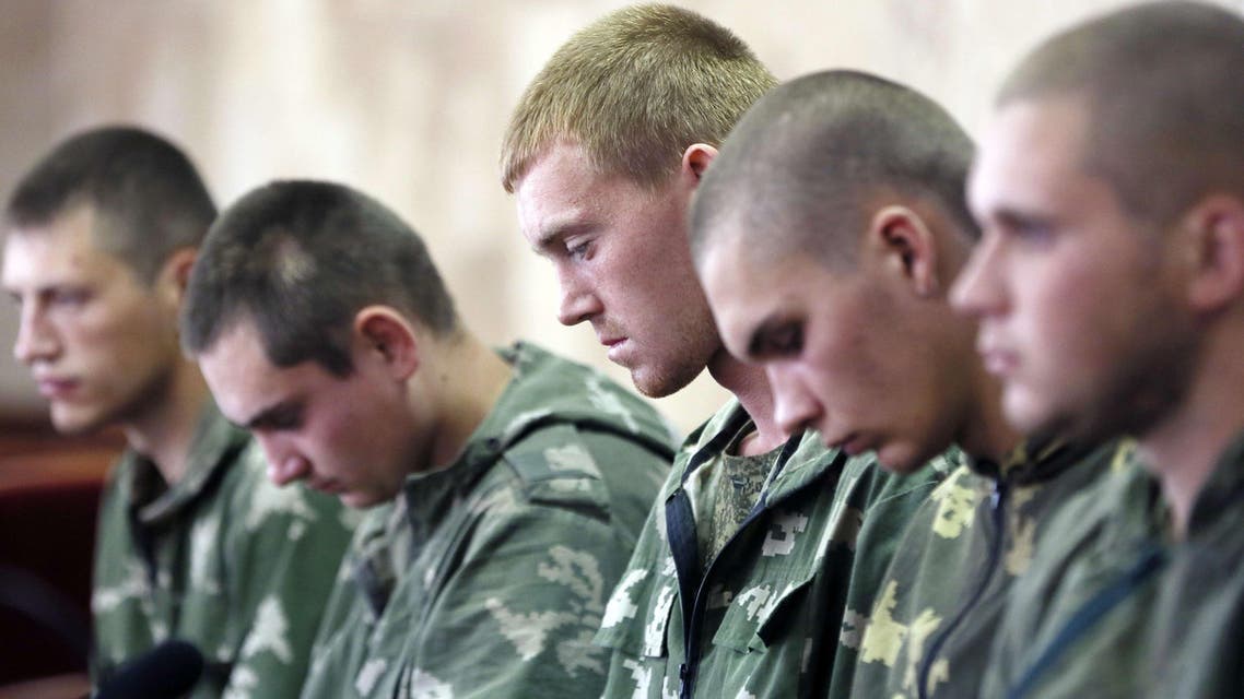 Russian paratroopers captured by Ukrainian forces near the village of Dzerkalne, Donetsk region, some 20 to 30 kilometres from the Russian border. (AFP)