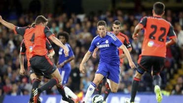 Chelsea's Fernando Torres (C) is surrounded by Real Sociedad players during their friendly soccer match at Stamford Bridge in London, August 12, 2014. (AFP)