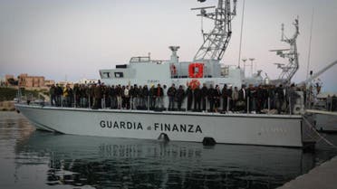 Migrants arriving from Tunisia and Libya aboard a Guardia Di Finanza boat after their own boat nearly sunk off the coast of Italy. (Photo courtesy: UN)