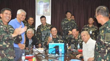Top defense and military officials cheer at Camp Aguinaldo on Sunday, Aug. 31, after the successful repositioning of Filipino peacekeepers. (Photo: CPL Palima, CRS-AFP)
