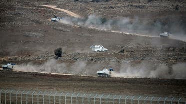 U.N. vehicles drive in Syria, near the border fence with the Israeli-occupied Golan Heights August 31, 2014. (Reuters)