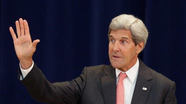 U.S. Secretary of State John Kerry waves goodbye during a ceremony to honor the appointment of Shaarik Zafar to be Special Representative to Muslim Communities in the Acheson Auditorium at the State Department September 3, 2014 in Washington, DC. (AFP)