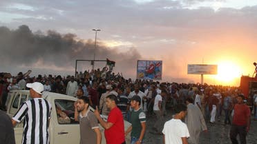 People gather at the scene of a Libyan war plane crash in the eastern city of Tobruk September 2, 2014. (Reuters)