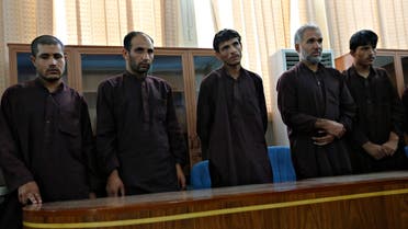 Five of seven men convicted of raping and robbing appear at a court in Kabul September 7, 2014. (Reuters)