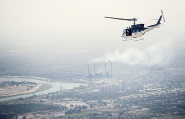  A U.S. State Department helicopter flies over Baghdad on September 10, 2014. (AFP) 