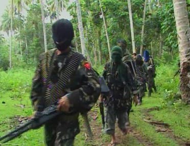 Abu Sayyaf rebels are seen in the Philippines in this video grab made available February 6, 2009. REUTERS